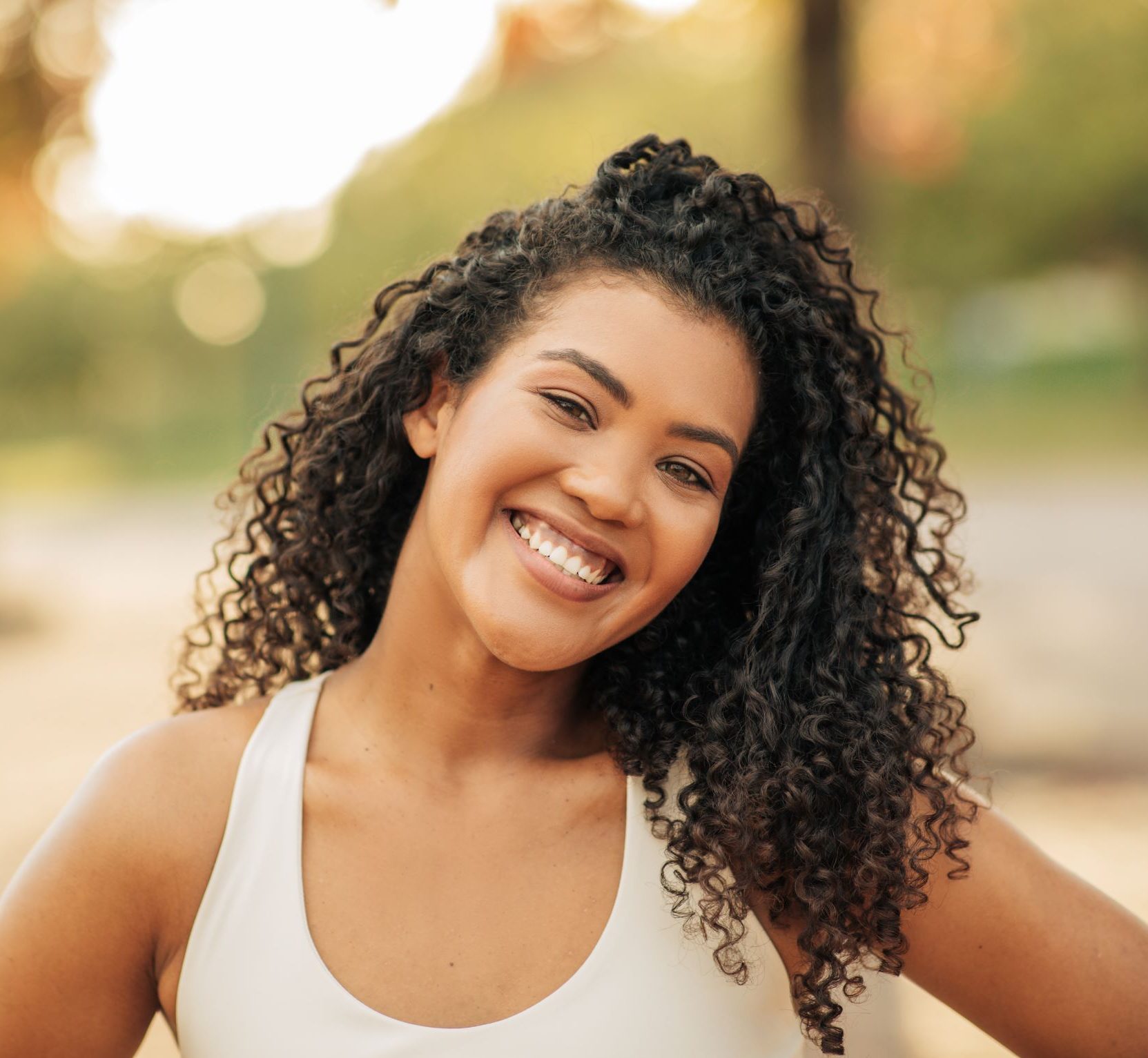 smiling athletic woman with curly hair have workou 2024 06 05 01 13 12 utc e1732175133816